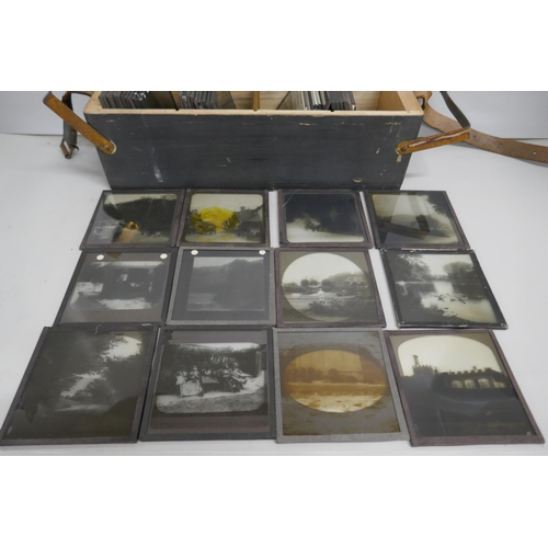 2204 - A box of 44 Victorian and Edwardian lantern slides, includes beach scenes, street scenes, motor car ... 