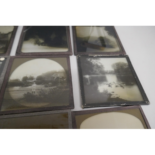 2204 - A box of 44 Victorian and Edwardian lantern slides, includes beach scenes, street scenes, motor car ... 