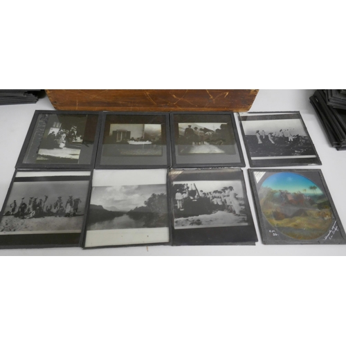 2205 - A box of 74 Edwardian lantern slides including bi-planes, tiger kill, Indian military life, mountain... 