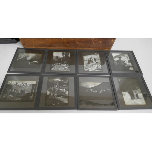 2205 - A box of 74 Edwardian lantern slides including bi-planes, tiger kill, Indian military life, mountain... 