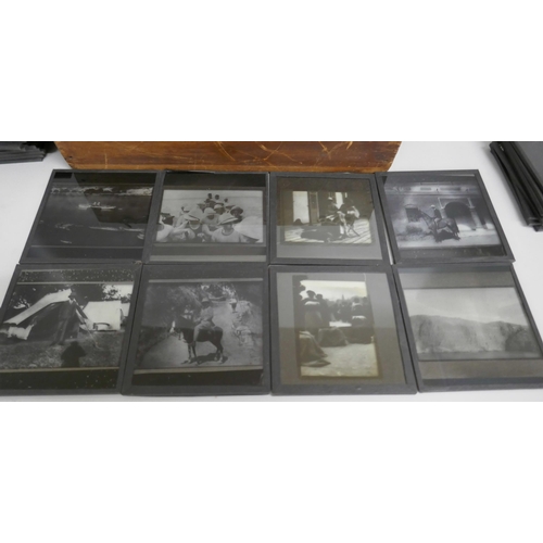 2205 - A box of 74 Edwardian lantern slides including bi-planes, tiger kill, Indian military life, mountain... 