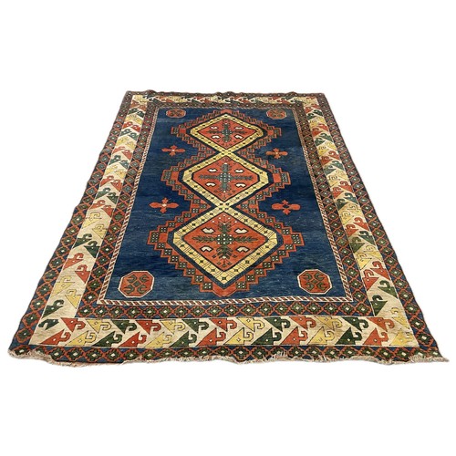 258 - A large eastern multi coloured rug, 336 x 229cms