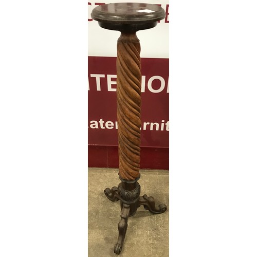 217 - A Victorian mahogany and rosewood barleytwist torchere