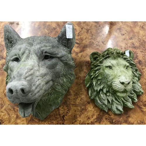 289 - Two concrete garden face masks, wolf and lion