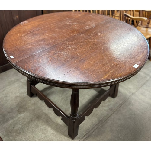 232 - An 18th Century style Ipswich oak circular dining table