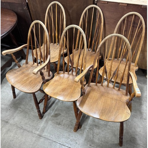 233 - A set of six elm and beech Windsor kitchen chairs