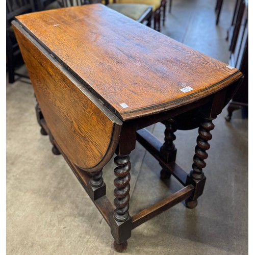 234 - An early 20th Century oak barleytwist gateleg table