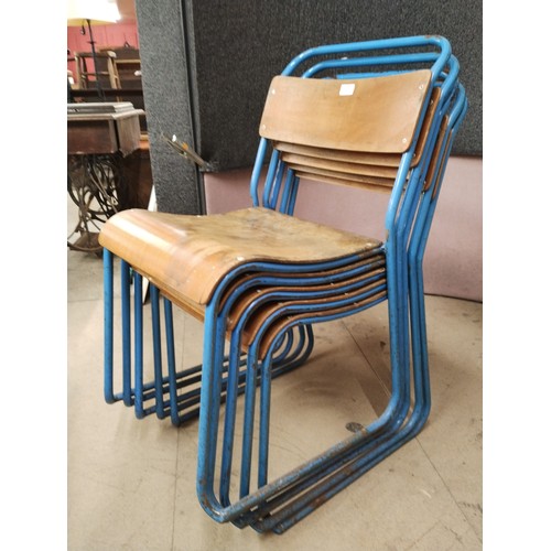 285 - A set of five blue tubular steel and ply wood stacking chairs