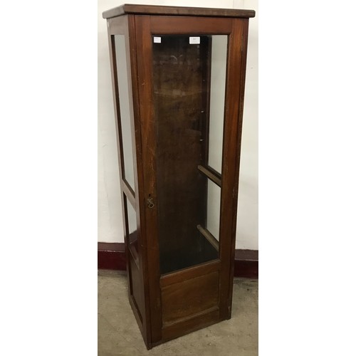 267 - An early 20th Century mahogany single door shop display cabinet, lacking shelves