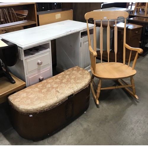 271 - A beech rocking chair and an early 20th Century oak ottoman