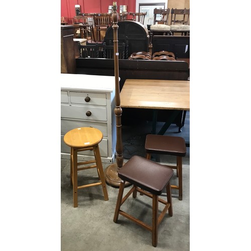 277 - A pair of leather topped stools, a pine stool with an oak standard lamp