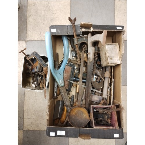 299 - A box of assorted vintage tools, including clamps, etc