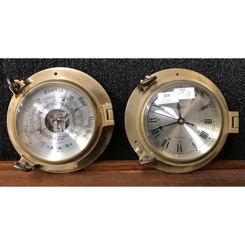 334 - A brass porthole style clock and barometer