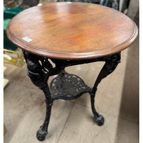 314 - A Victorian style mahogany and cast iron pub table