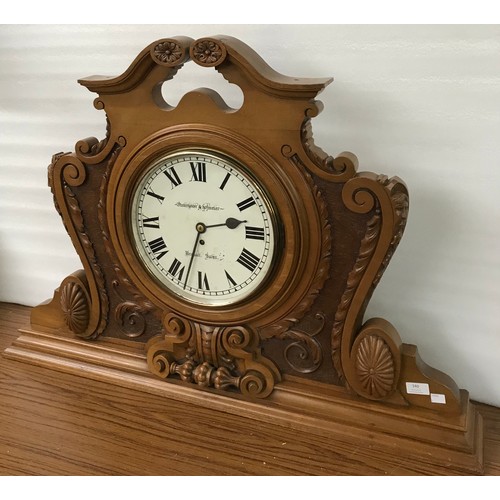 340 - A German Winterhalder & Hofmeier carved walnut single fusee bank clock