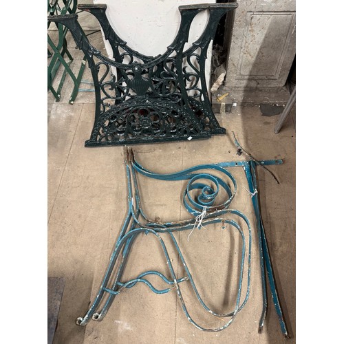 317 - A pair of cast alloy pub table legs and pair of wrought iron bench ends