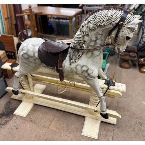 313 - An early 20th Century style painted rocking horse