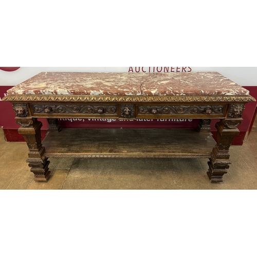 110A - A substantial Victorian Jacobean Revival carved oak and marble topped two drawer console table, made... 