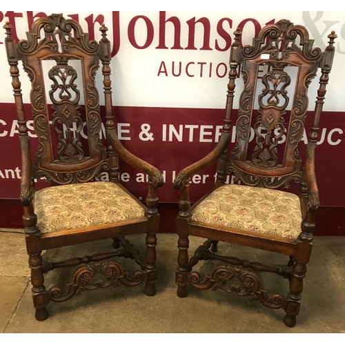 110B - A pair of Carolean style carved oak throne chairs