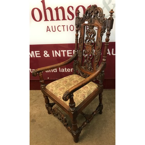 110B - A pair of Carolean style carved oak throne chairs