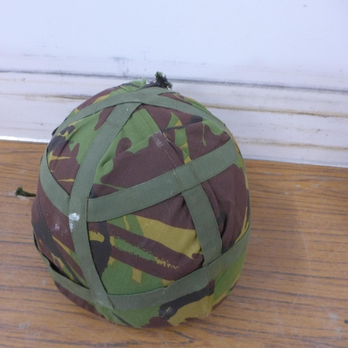 5255 - Two camouflaged combat helmets