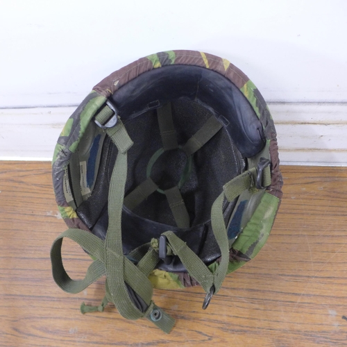 5255 - Two camouflaged combat helmets