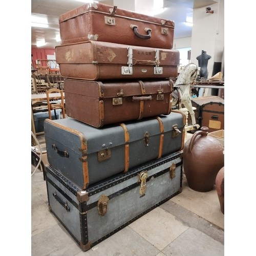 305 - Two steamer trunks and four suitcases