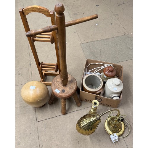 321 - A Victorian beech hat block, three stoneware flagons, a brass table lamp, a dolly peg and an oak cot... 