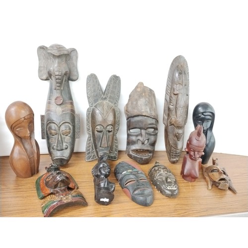 308 - Assorted African carved wood masks and figures