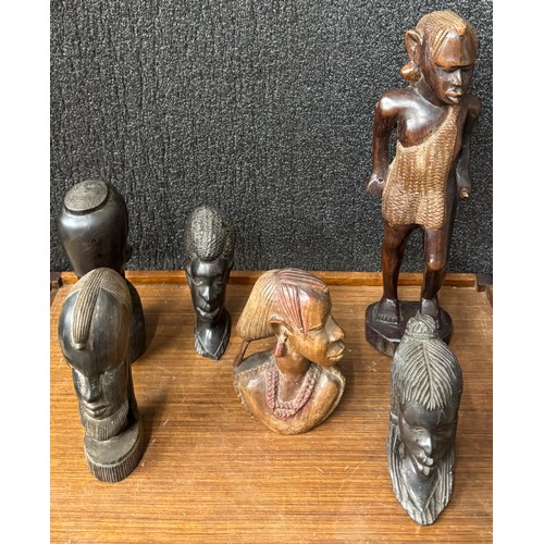 327 - An African carved wood figure and five small carved busts