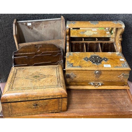 329 - An early 20th Century oak tantalus, a Victorian inlaid walnut writing slope, an oak letter rack and ... 