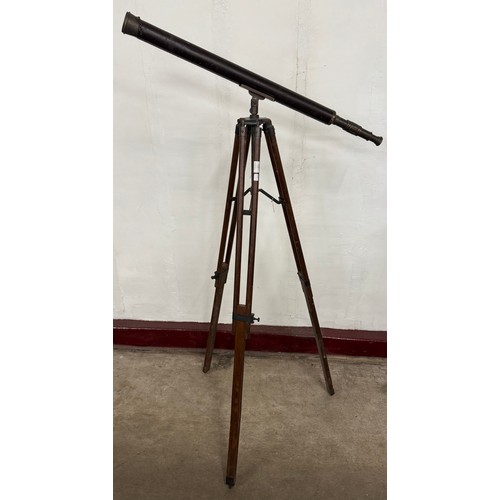 310 - An early 20th century brass telescope on tripod stand