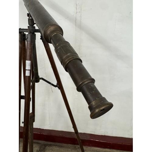 310 - An early 20th century brass telescope on tripod stand