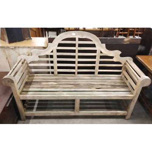 288 - A Lutyens style teak garden bench