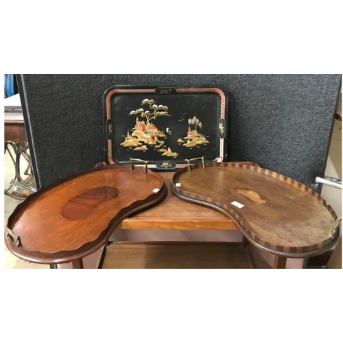 338 - Two Edward VII inlaid mahogany kidney shaped serving trays and a Japanned invalid tray