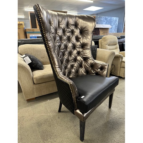 3249 - A leather wingback armchair