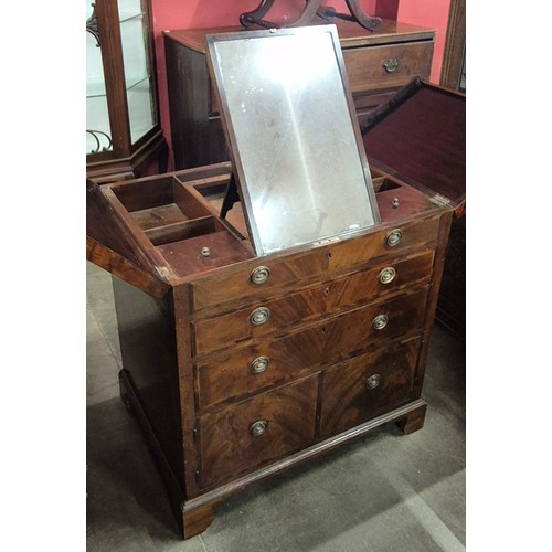 128 - A George III mahogany gentleman's fitted dressing chest