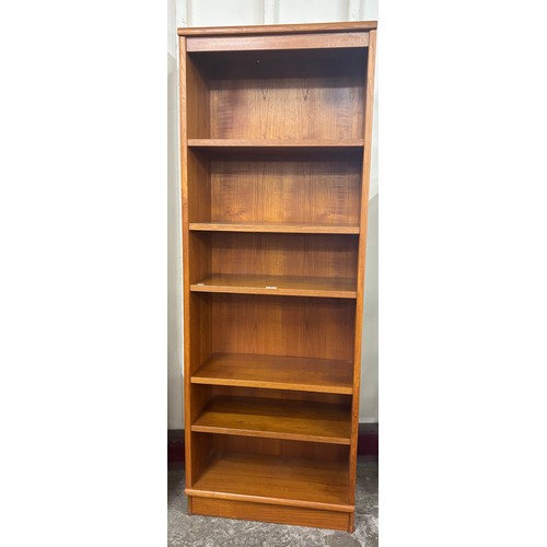 26 - A tall teak open bookcase