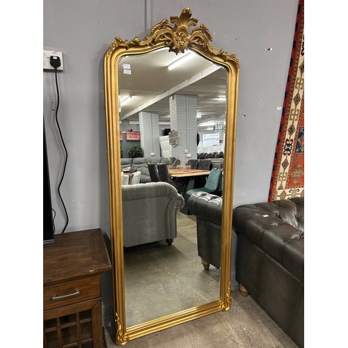 3033 - A large gold ornate free standing mirror