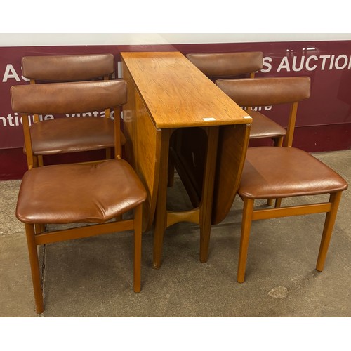 28 - A teak drop leaf table and four chairs