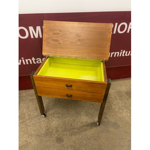 41 - A teak sewing trolley