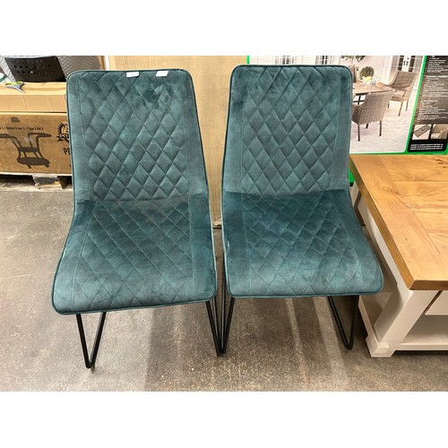 3068 - A set of four emerald green dining chairs  *This lot is subject to VAT