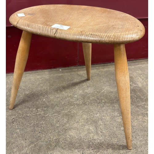 42 - An Ercol Blonde elm and beech pebble occasional table