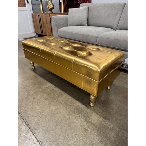 3076 - A gold ottoman footstool - (Marked)