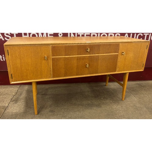 43 - A light oak sideboard