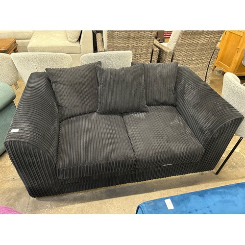 3145 - A black jumbo cord 2 seater sofa