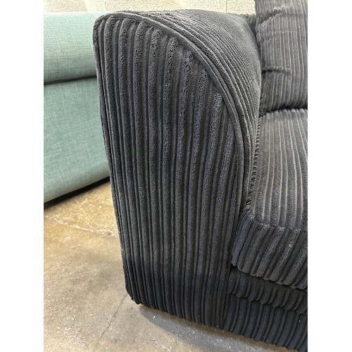 3145 - A black jumbo cord 2 seater sofa