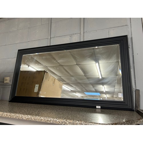 3156 - A large black framed mirror