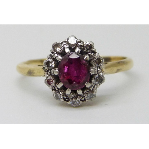 7019 - An 18ct gold and platinum set ruby and diamond cluster ring, 2.8g, M