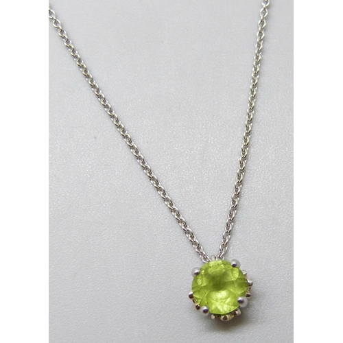 7031 - An 18ct white gold peridot pendant and chain with diamond set floral detail to setting, 3.6g, 6mm pe... 